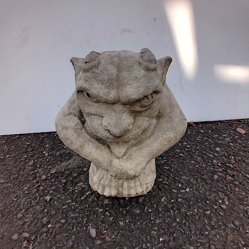 Crouching gargoyle with a weathered sandstone-coloured finish